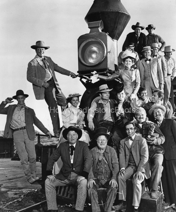 John Wayne 1963 McLintock with cast and crew on a Locomotive wm.jpg